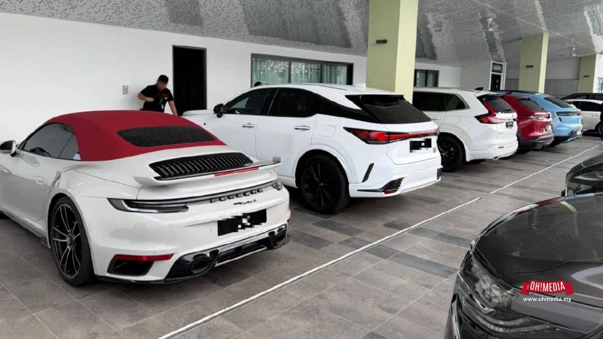 White Porsche Convertible with a Red Soft top Parked in a Covered Lot Beside Other White Suvs and Cars in a Showroom like Garage