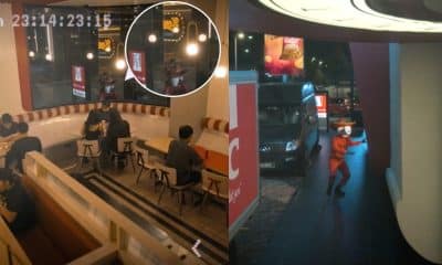 Split image: interior dining area with curved bench seating and several diners; a white circular inset highlights a figure near hanging pendant lights. Outside scene shows a person in an orange outfit with a white mask dancing beside a parked van at night near a storefront. The image has a visible timestamp in the upper left corner.